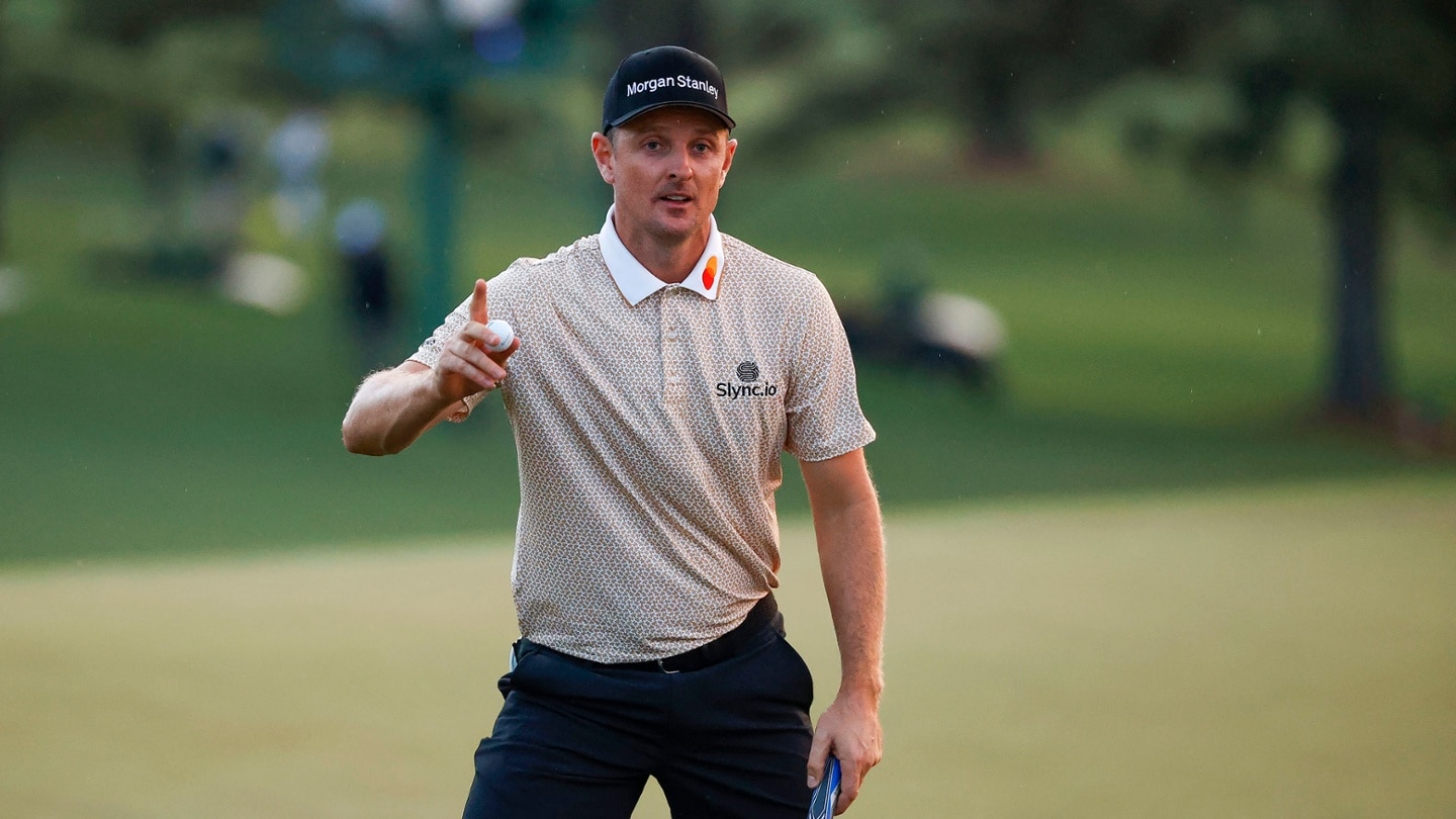 Justin Rose of England waves on the No. 18 green during Round 3 of the Masters at Augusta