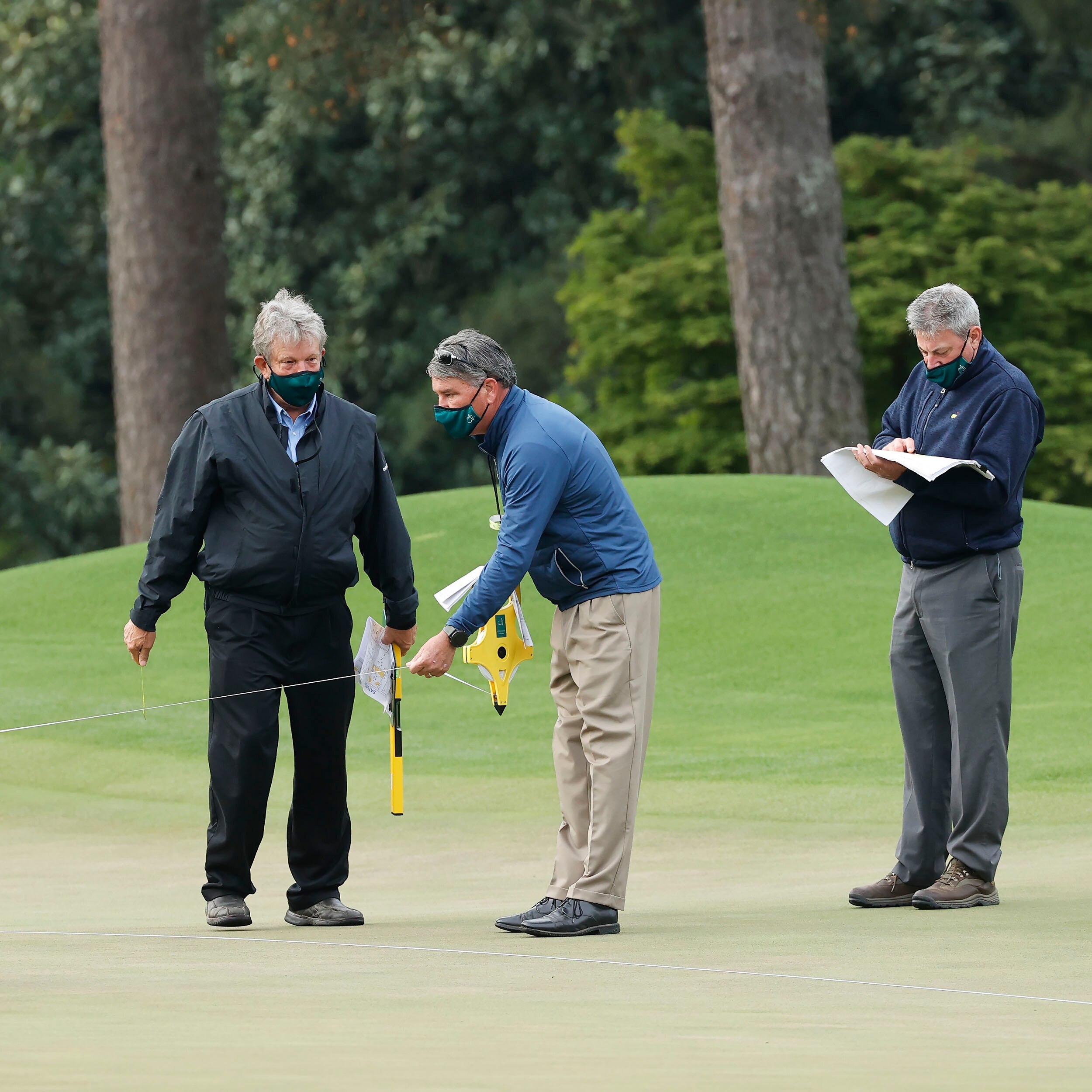 groundskeepers-cut-the-hole-on-the-no-8-hole-during-round-3-of-the