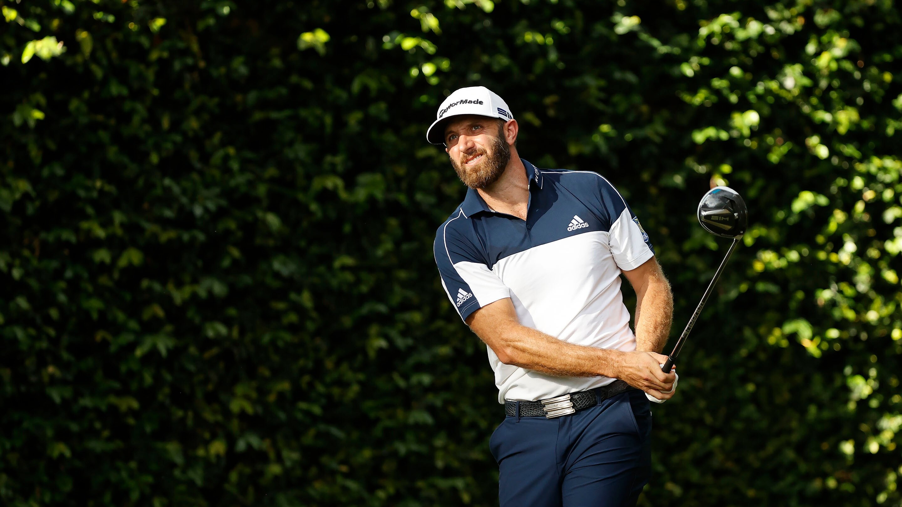 Dustin Johnson plays a stroke from the No. 2 tee during Round 1 of the