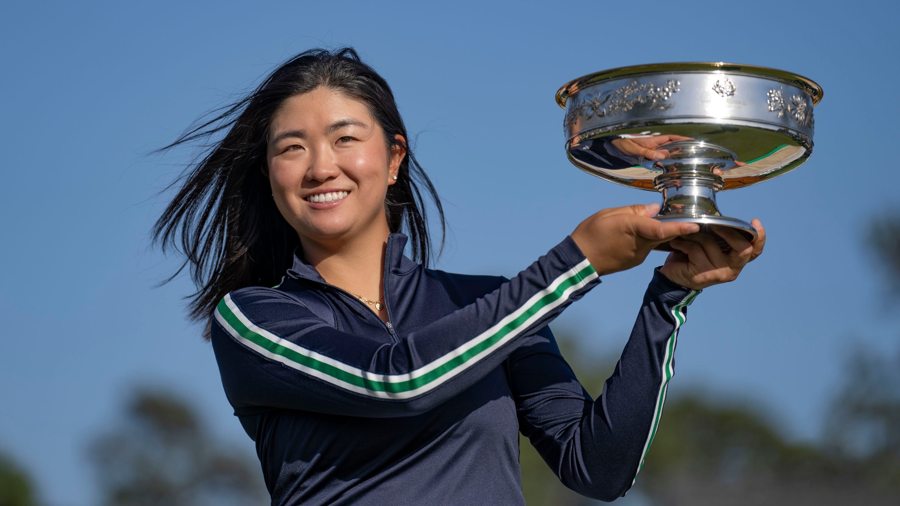 Rose Zhang of the United States lifts the Augusta National Women's Amateur Trophy after winning