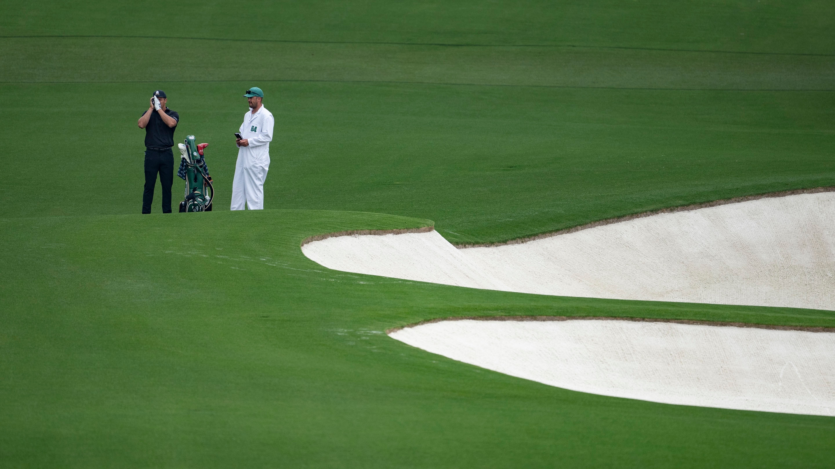 bryson-dechambeau-of-the-united-states-uses-a-rangefinder-on-the