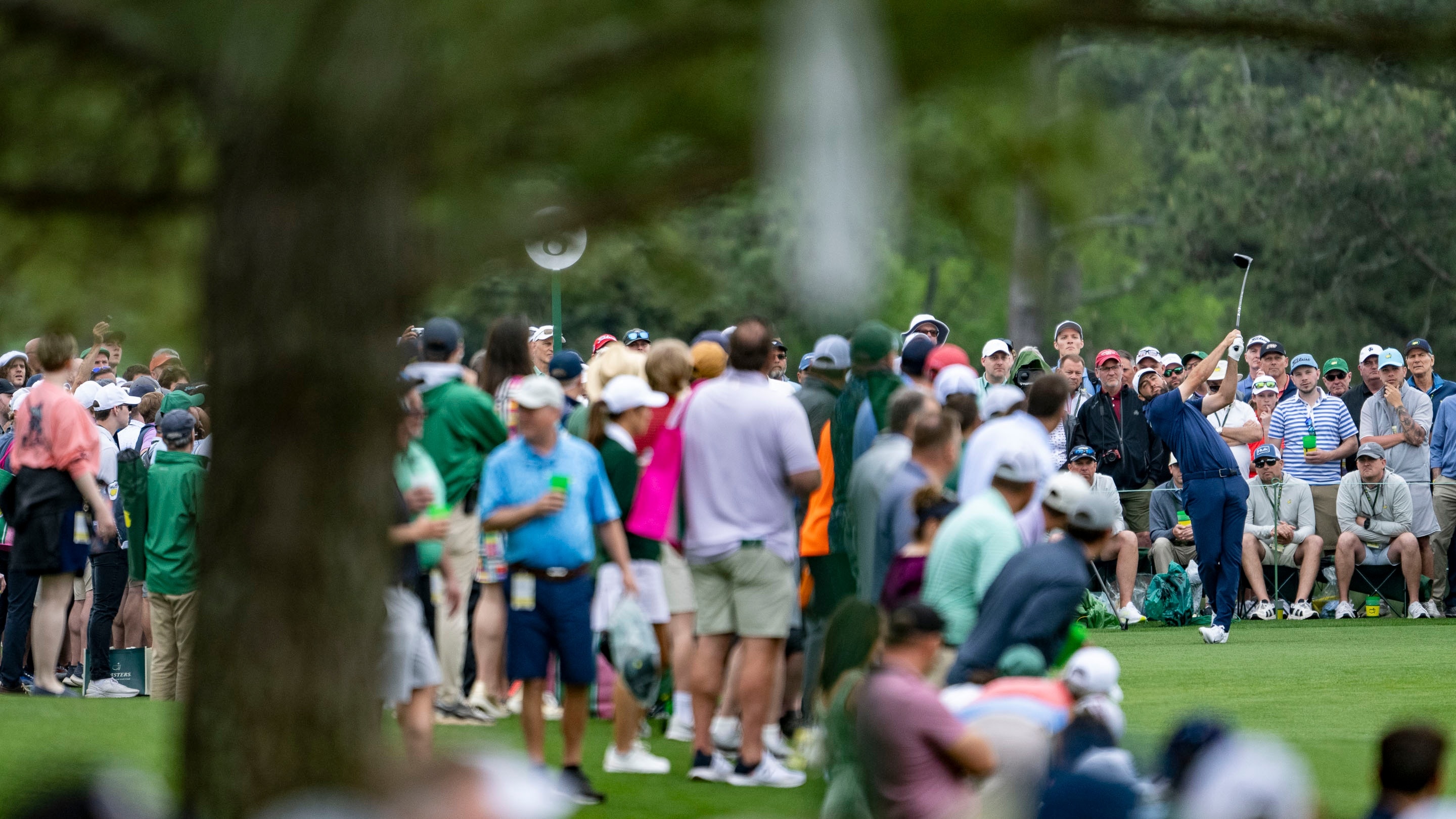 Masters champion scottie scheffler of the united states plays a stroke